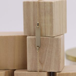 Gourmette junior Or jaune avec plaque rectangle